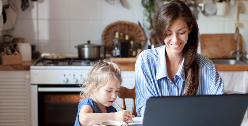 mom working remote with daughter